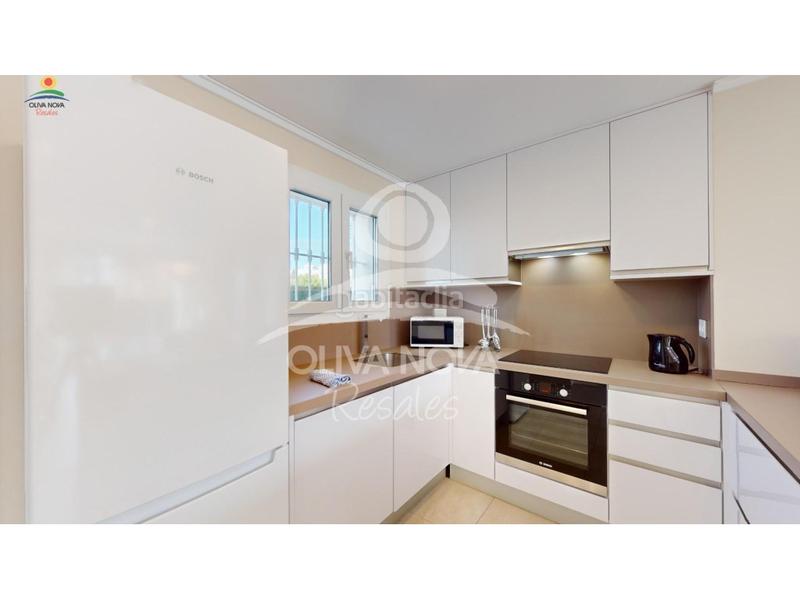 Foto 2855eb48-b459-47dc-bcd1-bc98e07ad0cb. Casa adosada malibú beach iii, 17 en Oliva nova Oliva