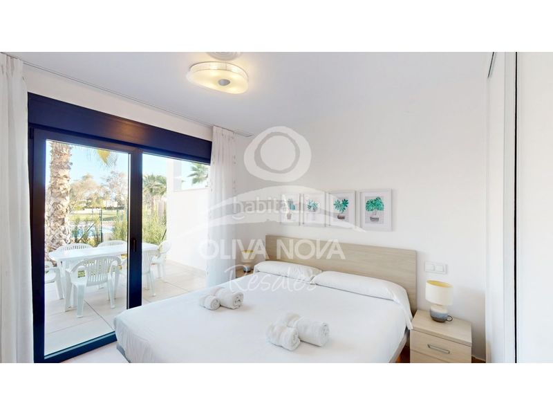 Foto 1714698c-e429-4097-86e5-8a9ac5e0b5aa. Casa adossada amb aparcament a Oliva nova Oliva