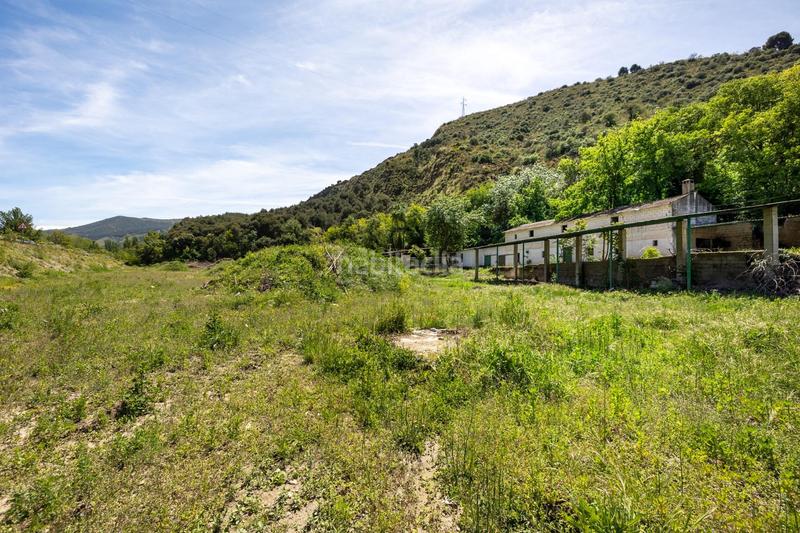 Foto e8da7e29-8f2d-4bc2-af9a-85321901841a. Rural plot in Cenes de la Vega