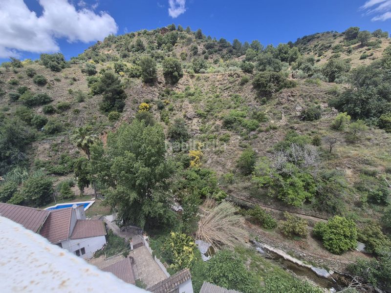 Foto 146716d1-3b21-48cb-8fc7-c72385d2eb1b. Casa adossada amb xemeneia calefacció a Tolox
