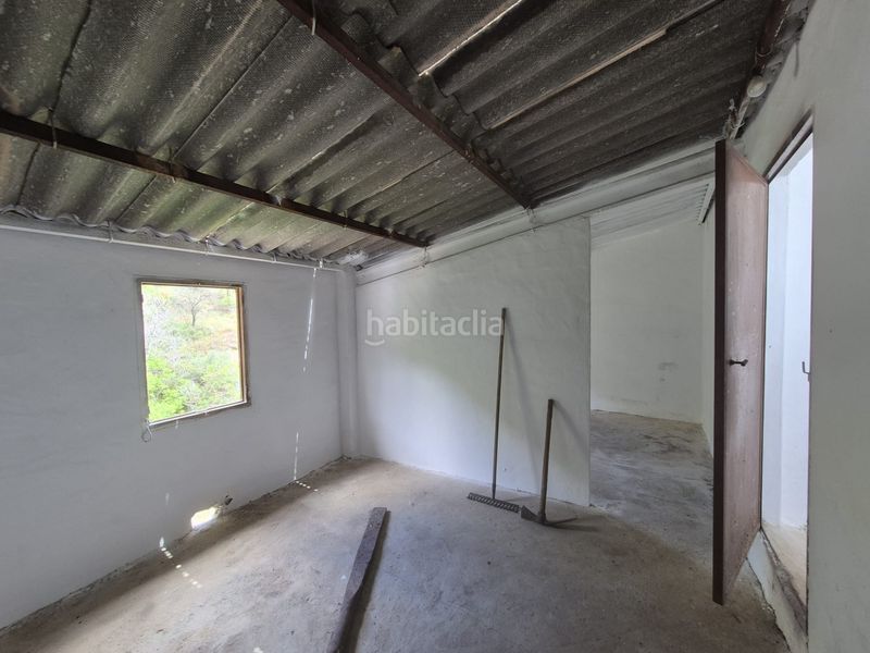 Foto cb2dec4d-5840-4cee-a79a-7e763cd2ae91. Casa adossada amb xemeneia calefacció a Tolox