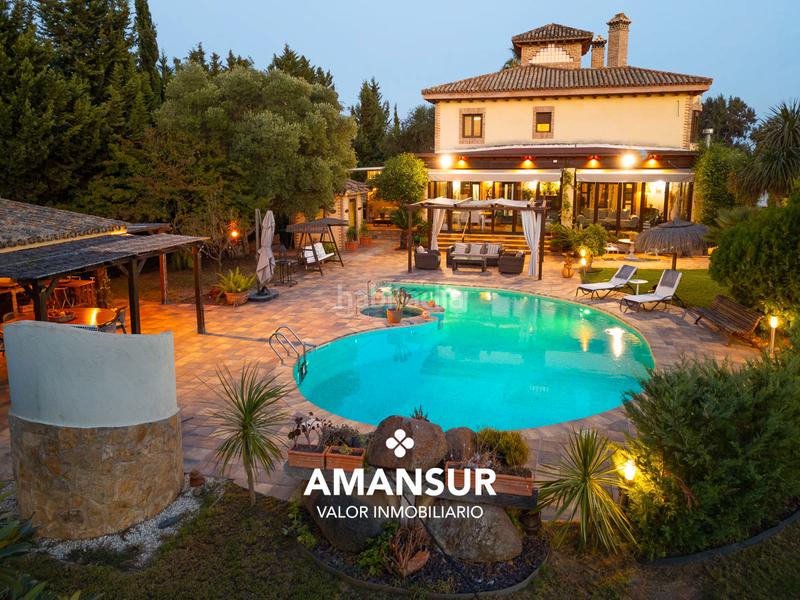 Foto 03a0ad8d-004f-45b4-8b1e-c1816ad59953. Chalet con camino riscaldamento parcheggio piscina in Aljaraque