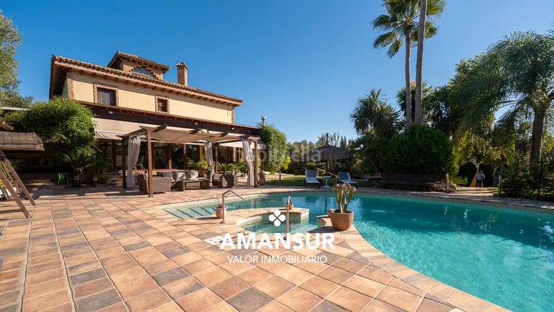 Foto 417456f3-756a-4137-a4e1-c5edf151639e. Chalet con camino riscaldamento parcheggio piscina in Aljaraque