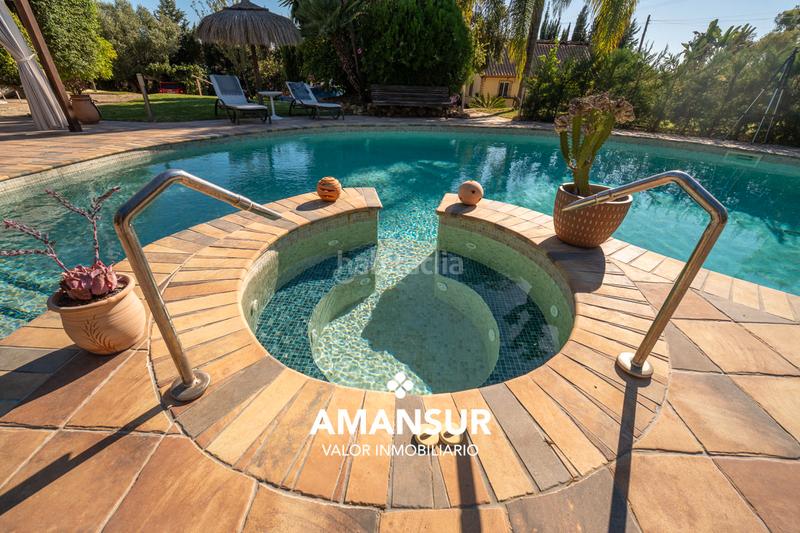 Foto d5614a1d-04bc-4191-a5a7-1a6b76b03905. Chalet con camino riscaldamento parcheggio piscina in Aljaraque