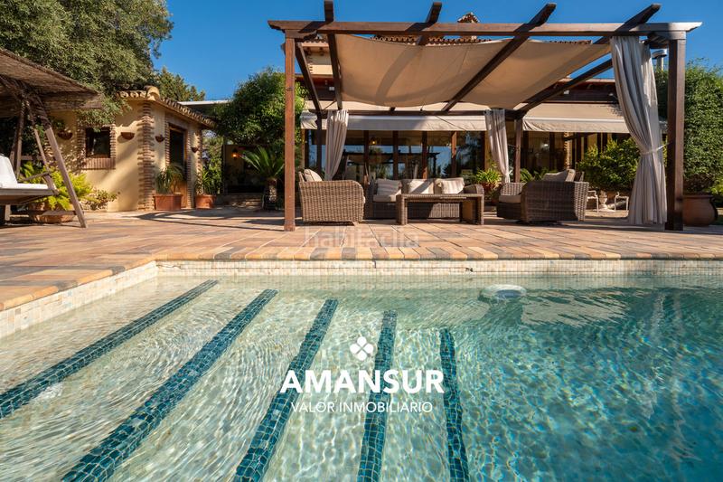 Foto ea14c17a-68c7-4535-8b59-0299a2161cf7. Chalet con camino riscaldamento parcheggio piscina in Aljaraque