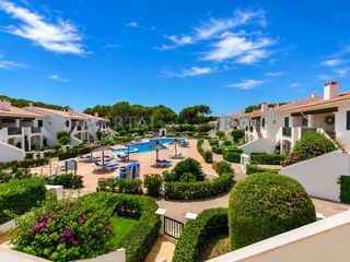 Appartement à Port d´Addaia. Espacioso apartamento con terraza y piscina en addaia