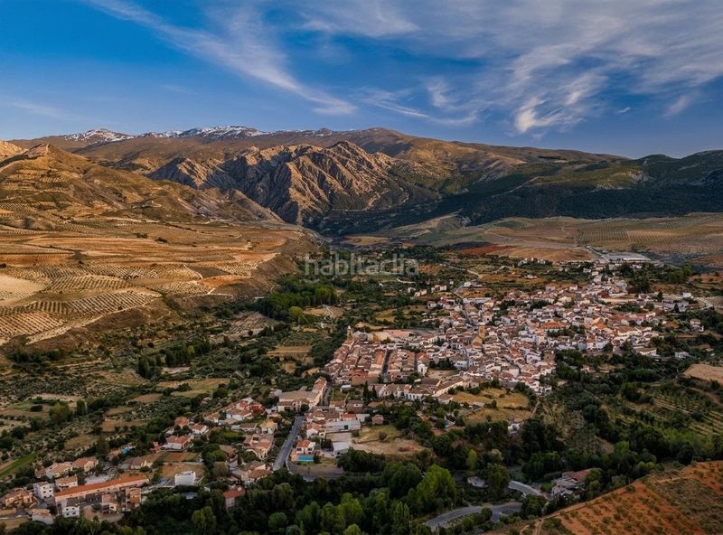 Foto c6c61fa5-dd02-4e6d-adec-7483efd69571. Casa amb aparcament a Dílar