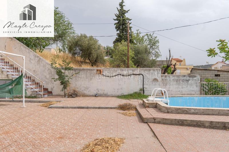 Foto 7bf92971-e46b-4182-8307-4ac7100f0f76. Chalet en camino de la barrera (far) 58 el Fargue 2000 metros de parcela segregable con chalet de 178m en tres plantas mas nave de 90 metros en Granada