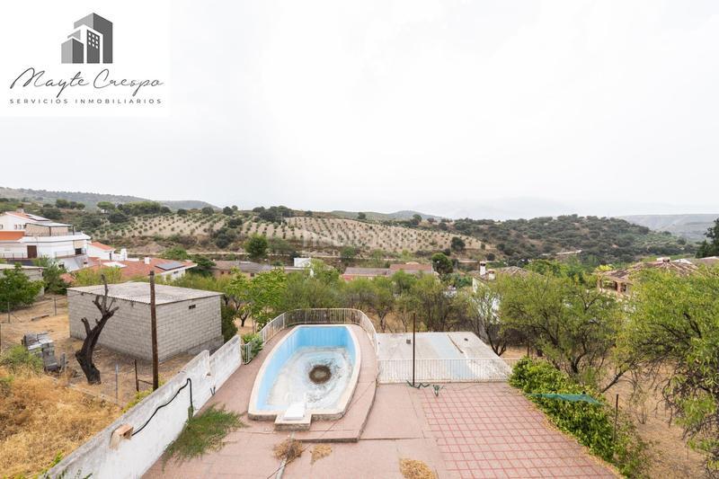 Foto b060b2be-56ea-49ac-8d7c-2a79c885c648. Chalet en camino de la barrera (far) 58 el Fargue 2000 metros de parcela segregable con chalet de 178m en tres plantas mas nave de 90 metros en Granada
