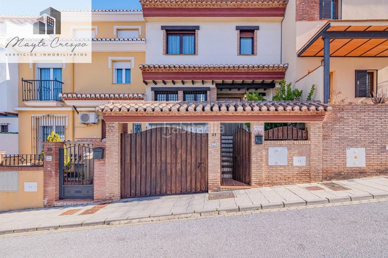 Foto a06d8fa5-7c5f-463c-8510-c34cef4462db. Casa adossada amb calefacció aparcament piscina a Zubia (La)