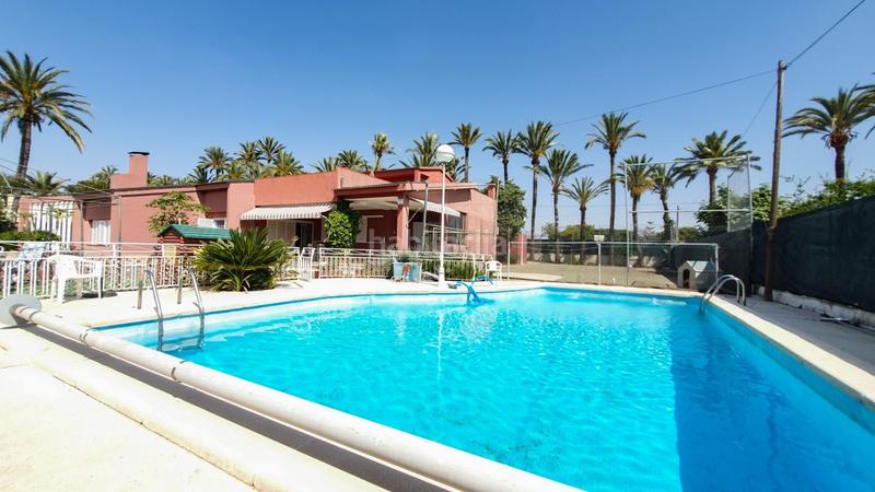 Foto 3f9585b9-f890-4a1d-a337-f62e0cc93d08. Chalet venta chalet, casa invitados, piscina, pista deportiva, huerto, zona hospital elche en Elche / Elx