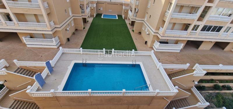 Foto 003936b4-1d7e-49f1-9b11-d0749e758f27. Lloguer apartament amb aparcament piscina a Los Arenales del Sol Elche / Elx
