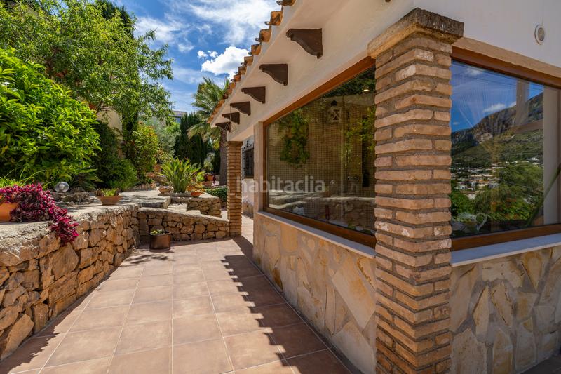 Foto 03be77b4-c1cc-4d5c-96cf-12e120ce6308. Chalet en venta en denia este acogedor y soleado chalet de estilo rústico, con unas vistas impresionantes al montgó en Dénia
