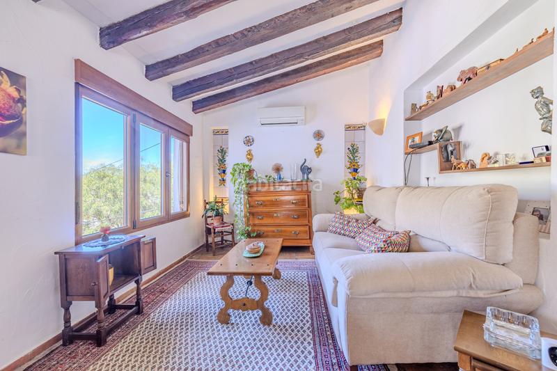 Foto 0f50b3f3-49b0-48fa-86fe-1e8ba42ba958. Chalet en venta en denia este acogedor y soleado chalet de estilo rústico, con unas vistas impresionantes al montgó en Dénia