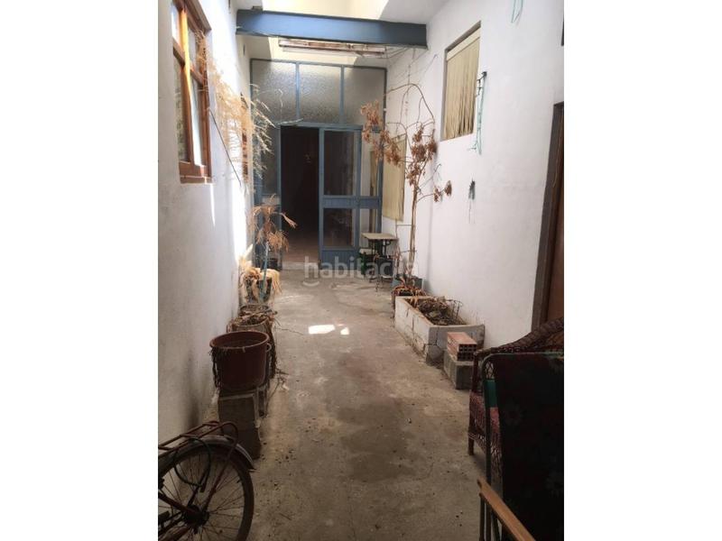 Foto cc6bb55a-fee5-42c5-916e-562760ebbd1c. Casa adossada amb aparcament a Guadassuar