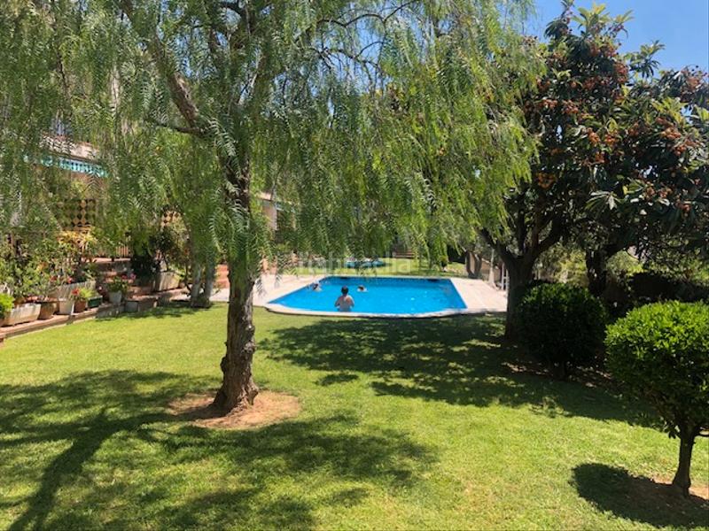 Foto 0c7f2fd6-e05c-4ed6-aa33-e2c9d0786f7c. Casa adossada amb xemeneia aparcament piscina a Altafulla