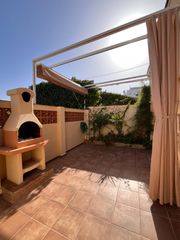 Chalet  Calle focha. El portil, magnífica casa adosada de dos dormitorios con gran te