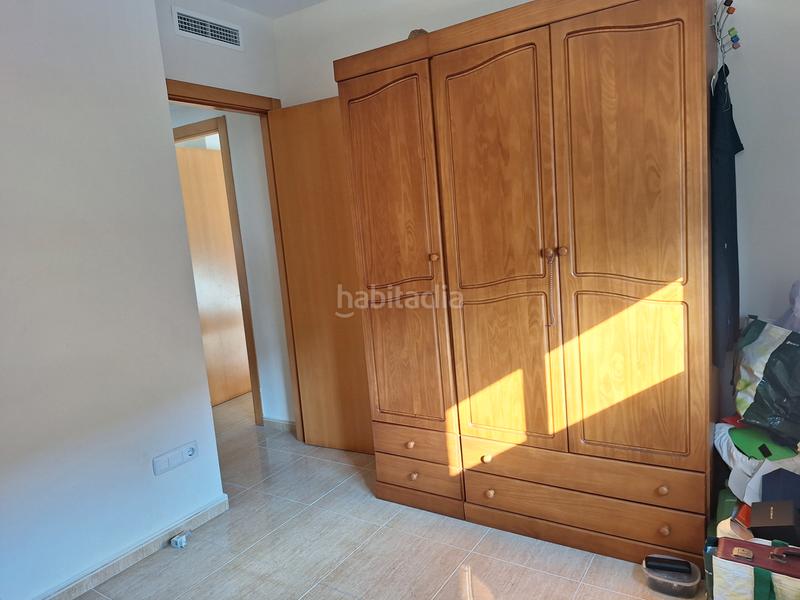 Foto ad8c3bfc-2031-49df-a1c9-42a53860623b. Casa aparellada amb aparcament a Les Palmeres Sueca