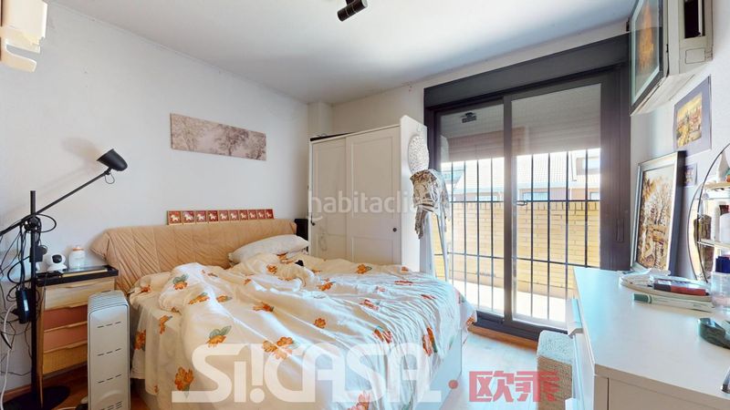 Foto a5e5874e-ae79-43e5-ad13-0fbf8ac83dee. Casa adossada amb calefacció piscina a Las Américas Parla
