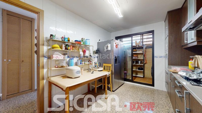 Foto f72942a8-4386-4d57-9632-fd999abdd87c. Casa adossada amb calefacció piscina a Las Américas Parla