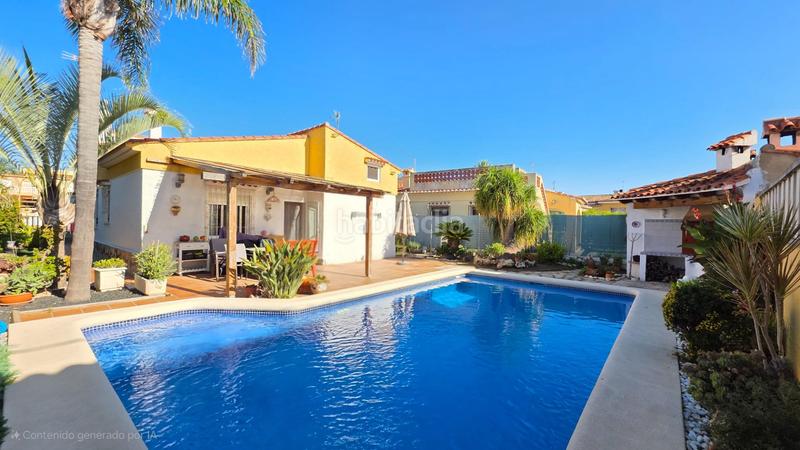 Foto 512b9ecf-00c9-4e1f-a571-6d182a3b090c. Chalet  en playa en Oliva playa Oliva