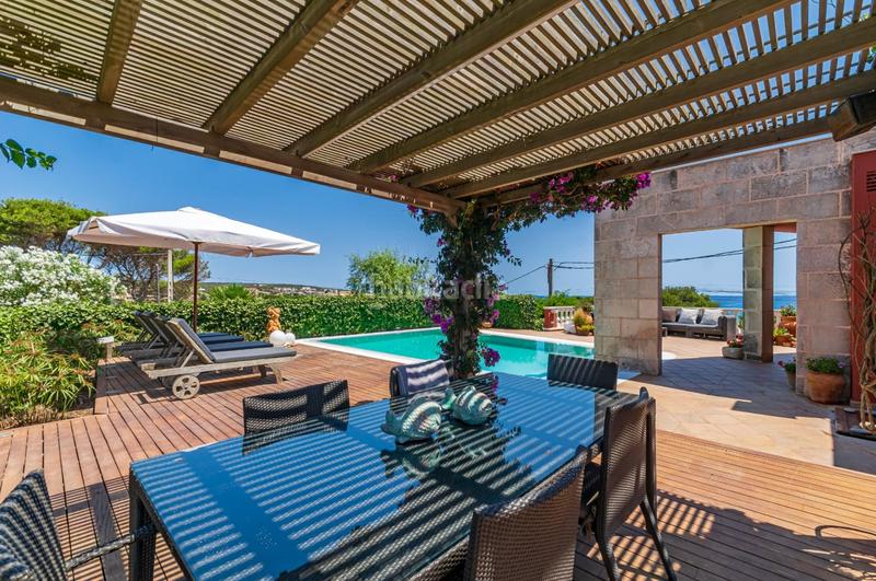 Foto 9b5527c3-d0f8-443e-a772-eac7459aed9a. Chalet fantastica villa con vista al mar en punta prima en Sant Lluís