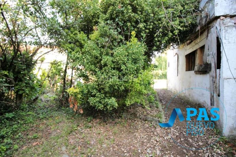 Foto 2769208c-af60-4eab-af10-2429cdb6d18e. Chalet en Tanos, casa de dos plantas con preciosa finca en suelo urbano en Torrelavega