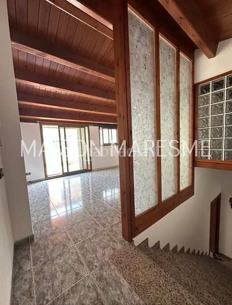 Foto ff0e9dd7-b2da-4daa-abd6-bc1573873ccb. Casa adossada a Canet de Mar