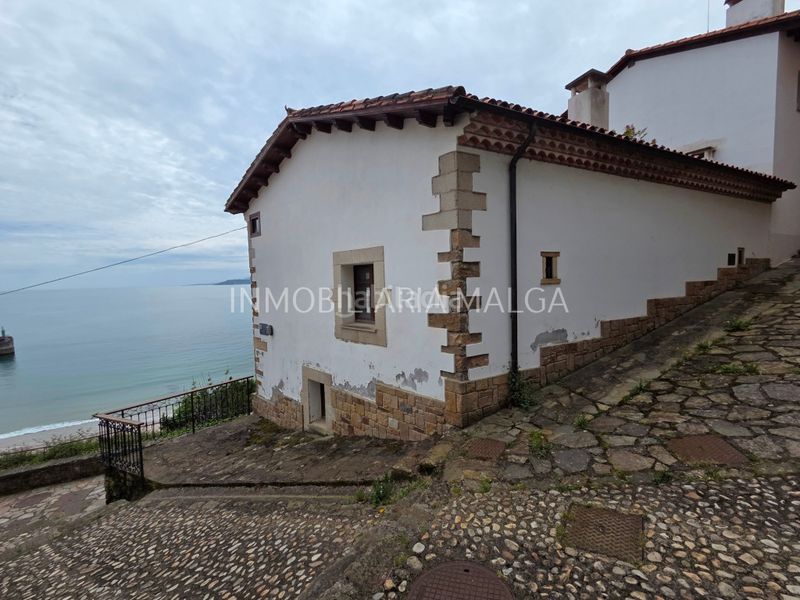Foto f416b71e-c2e0-420b-8ef3-d55601d0804e. Casa con camino riscaldamento in Colunga