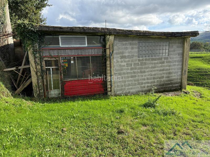 Foto e4e8d51b-e65f-4953-b4b6-36e7dd86790a. Nave industrial en campos delante nave en Riotuerto