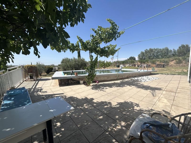 Foto bedd5639-0de5-43c8-980c-f61c416c345c. Masia amb piscina a Corella
