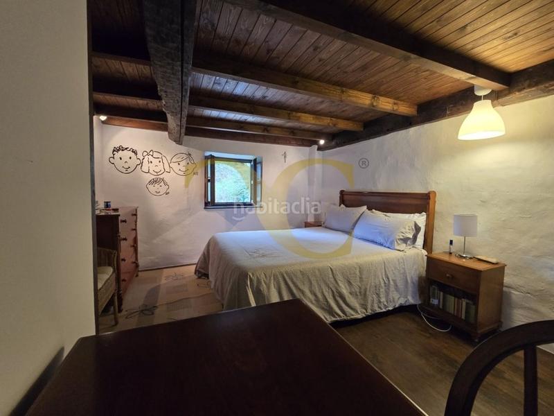 Foto 5291cbb5-4d4c-4427-8aeb-1e3efc4558ee. Casa adosada exclusiva preciosa casa tradicional con jardín a 5 kilómetros de la playa. en Llanes