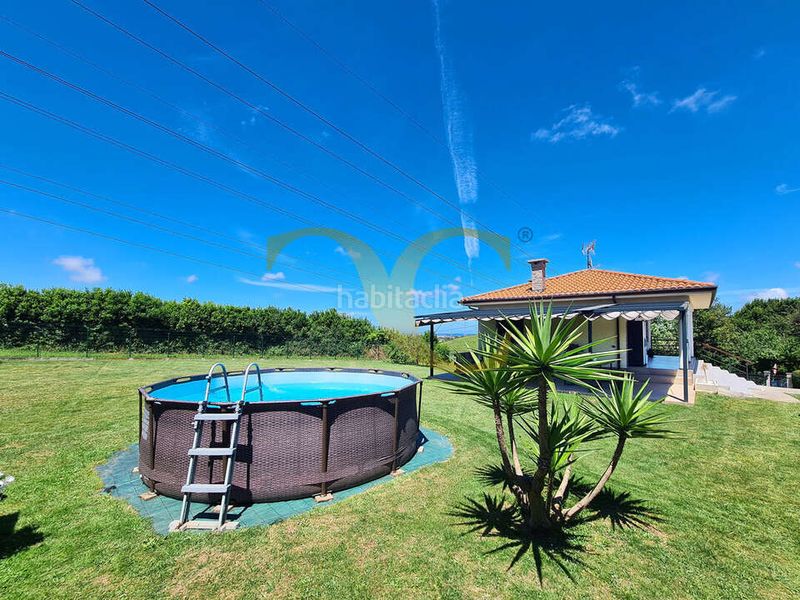 Foto 1cf019c8-77a7-4ee8-a346-36c1a102fde7. Casa amb calefacció aparcament piscina a Roces Gijón