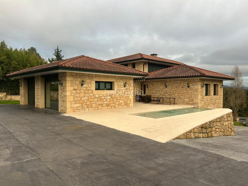 Foto 782f4f9c-29e4-46f1-943d-450c626c09b0. Chalet avec chauffage parking piscine dans Loiu