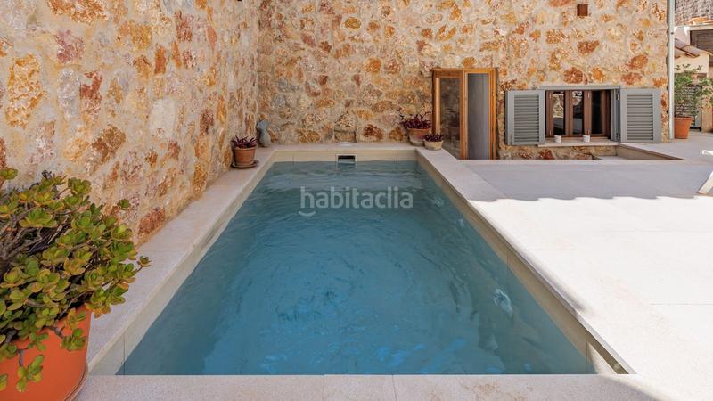 Foto 913bc116-d0f4-4d19-82fe-326f599cd6ca. Casa adossada amb calefacció aparcament piscina a Pollença