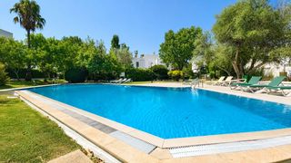 Apartament a Port de Pollença. Planta baja en port de pollença con jardín privado, piscina y pa