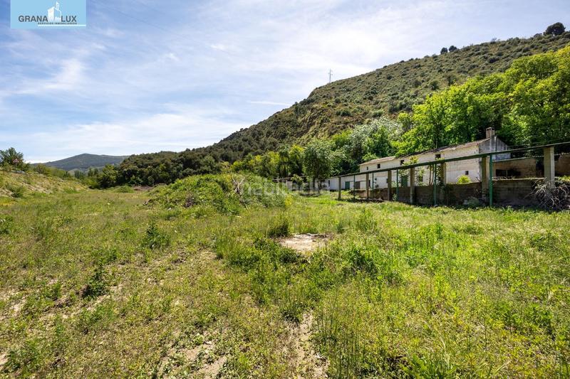Foto f37f9c46-3dfb-4901-ba79-401886be67f8. Rural plot in Cenes de la Vega