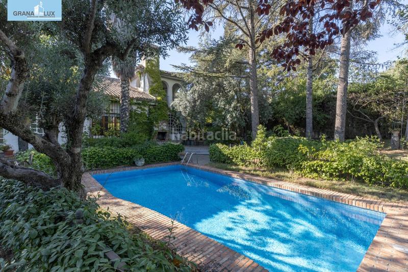 Foto 23a2eb4a-5e2c-43e6-a992-c40c0c1cdb19. Chalet magnifico chalet con amplio jardines y piscina en cortijo del aire! en Albolote