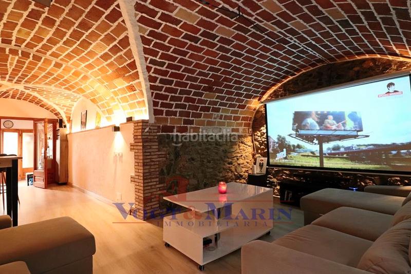 Foto f2de7e57-34ad-423b-b956-9bd453ec96c0. Casa adosada casa con encanto rústico-modernista en el corazón en Garriguella