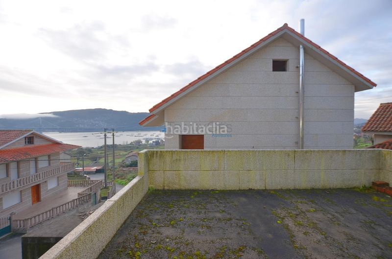 Foto 1080499b-fbe5-47a6-9c8c-fc4b0d3453c9. Casa aparellada amb aparcament a Moaña