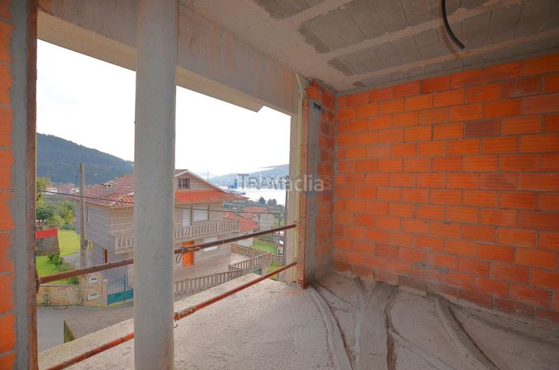 Foto 587d59ea-b6d1-4948-bf93-e5a1e3ae3939. Casa aparellada amb aparcament a Moaña