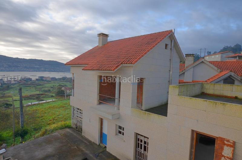 Foto c7fddb86-dd85-4e38-ab96-1a1b334563d7. Casa bifamiliare con parcheggio in Moaña