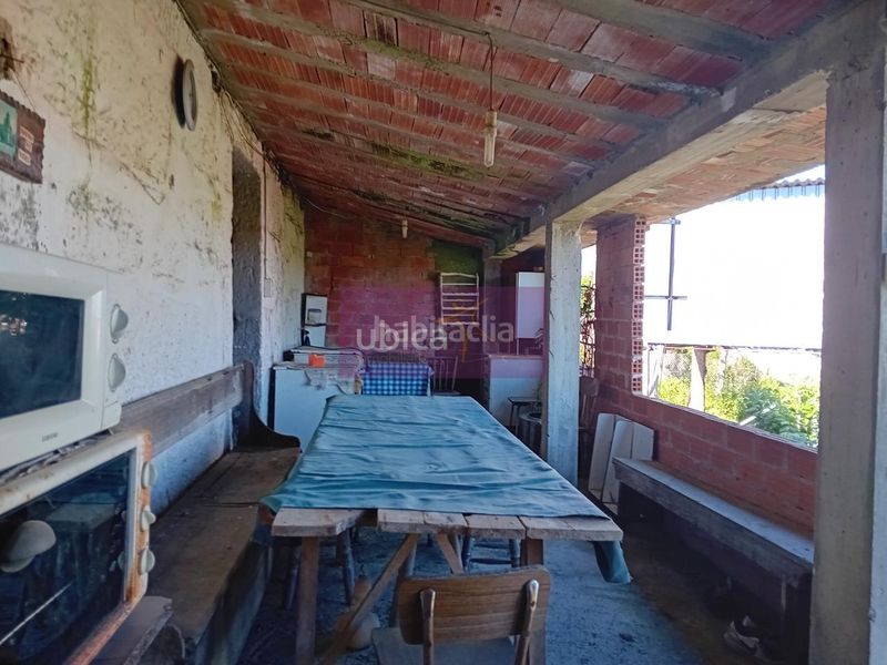 Foto d5eb9b3f-95a3-4338-a8cc-e9e5ad57db8f. Casa adossada a Ponteareas