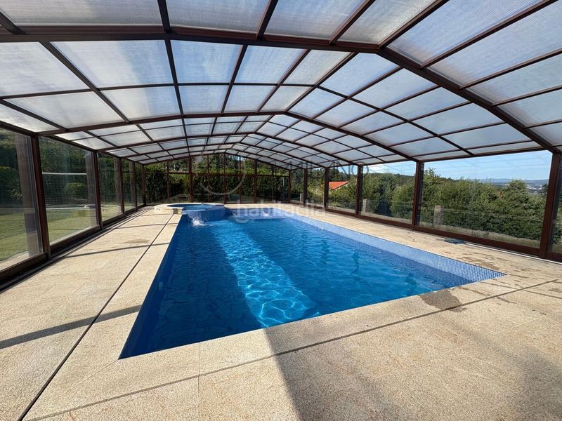 Foto 5c2efc26-8f84-4705-9b81-e77993c9a930. Casa con riscaldamento parcheggio piscina in Combarro Poio