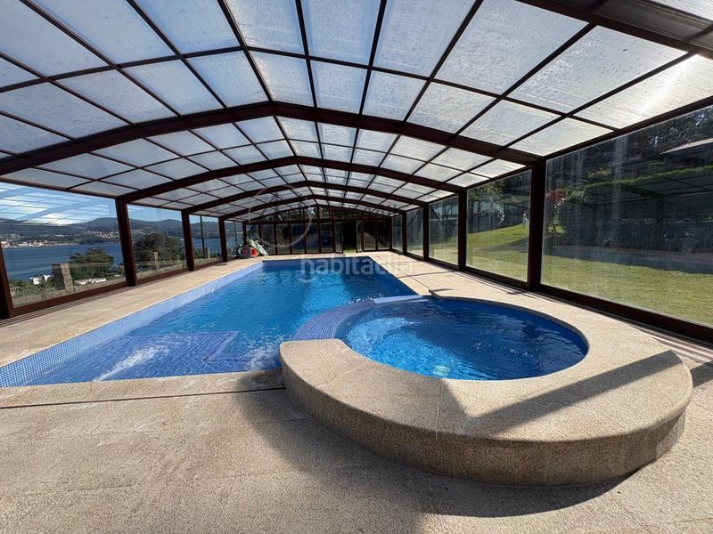 Foto 6c758c49-9d9e-4db8-bdd1-9d1d37c3fc38. Casa con riscaldamento parcheggio piscina in Combarro Poio