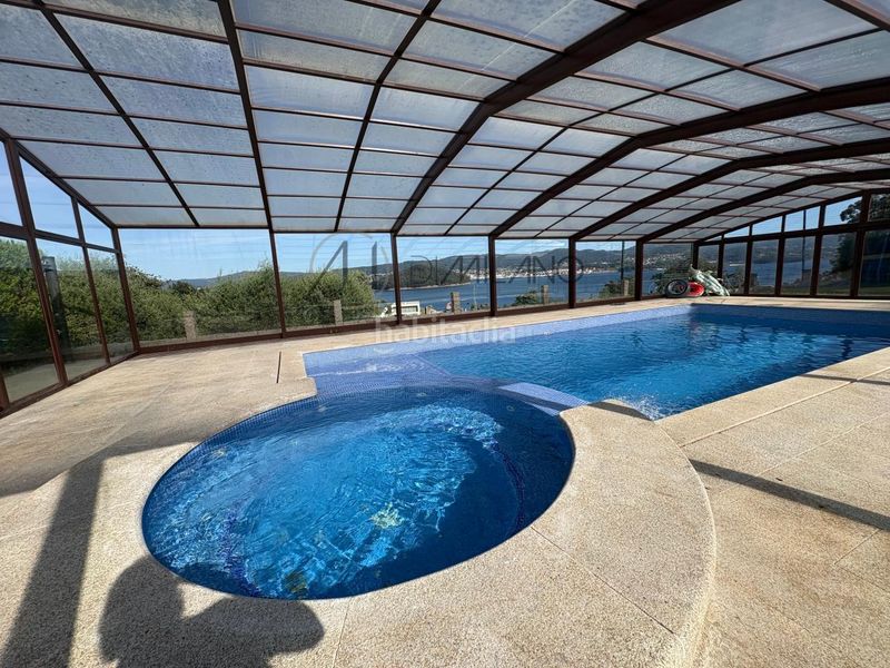 Foto f1e7559c-0152-49c9-95c9-1ea4fb3401ab. Casa con riscaldamento parcheggio piscina in Combarro Poio
