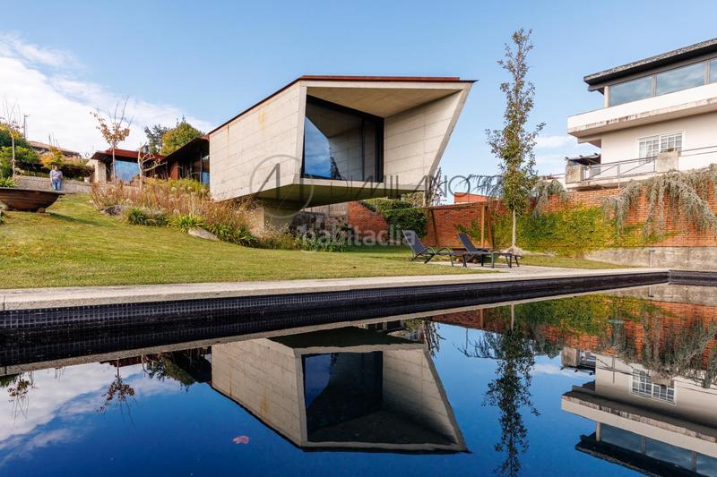 Foto 49389679-cefb-4d7a-b23a-c019edfd94e8. Casa con riscaldamento parcheggio piscina in Panxón Nigrán