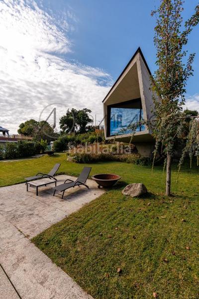 Foto cd7c1d3e-7919-44b0-b5e8-3d2f65413b2e. Casa con riscaldamento parcheggio piscina in Panxón Nigrán