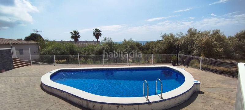 Foto 55aa335c-84eb-4e0f-adfd-9c811f9be164. Casa adossada amb aparcament piscina a Alcanar