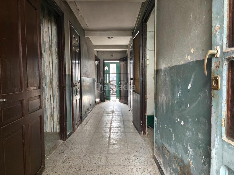 Foto fbf7e411-2655-45b2-96bb-0c3c19c60ecd. Casa adosada  con bodega y finca en piñeiros, en Narón